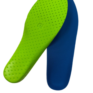 Close-up of lime green perforated insole overlapping a blue athletic insole, showing textured surface and small holes for breathability.