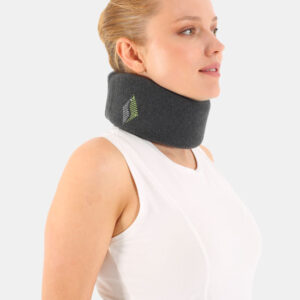 Profile of a woman wearing a dark foam cervical neck brace with a small green logo on the side