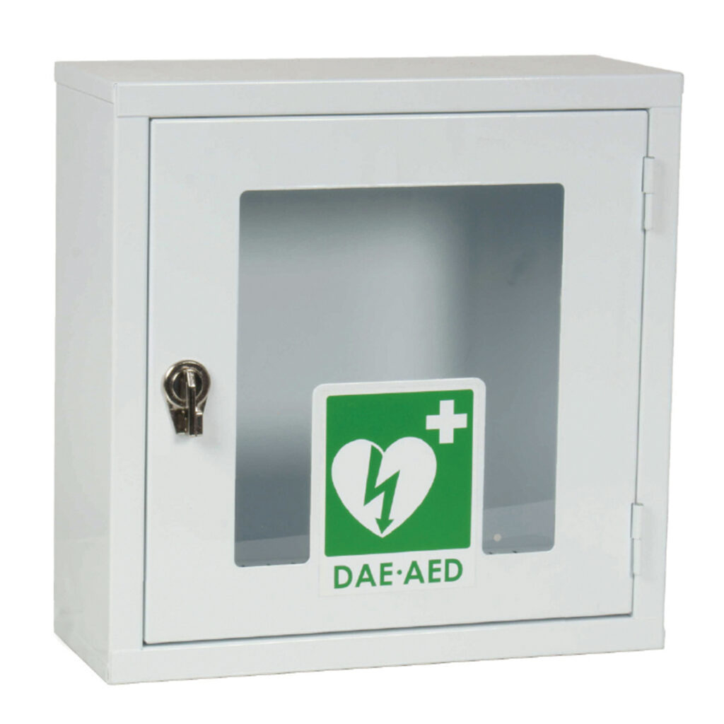 White wall-mounted cabinet with a transparent window showing a green DAE-AED first aid sign (heart with bolt) inside, and a small lock on the left side.