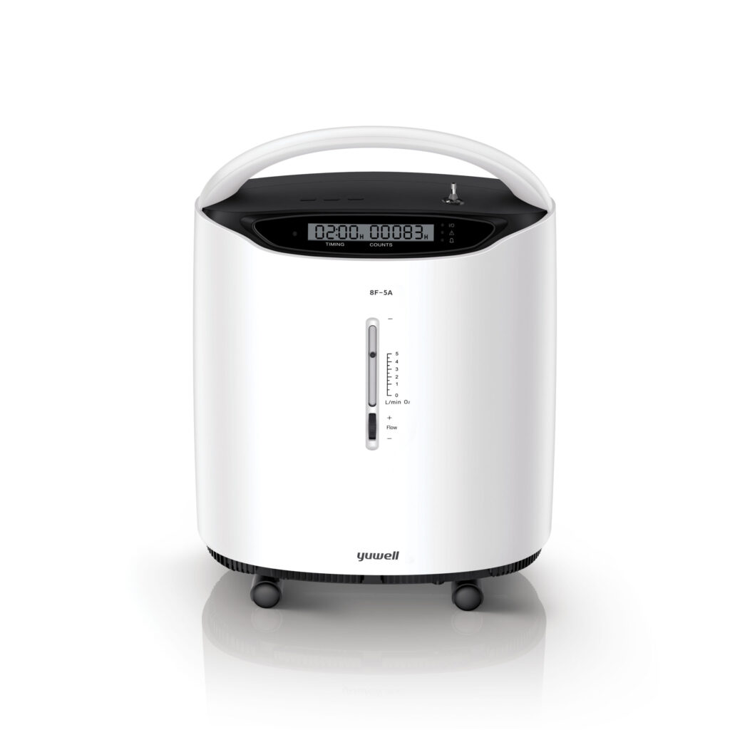 White oxygen concentrator on wheels with a digital display and control panel at the top, showing flow gauge markings on the side.