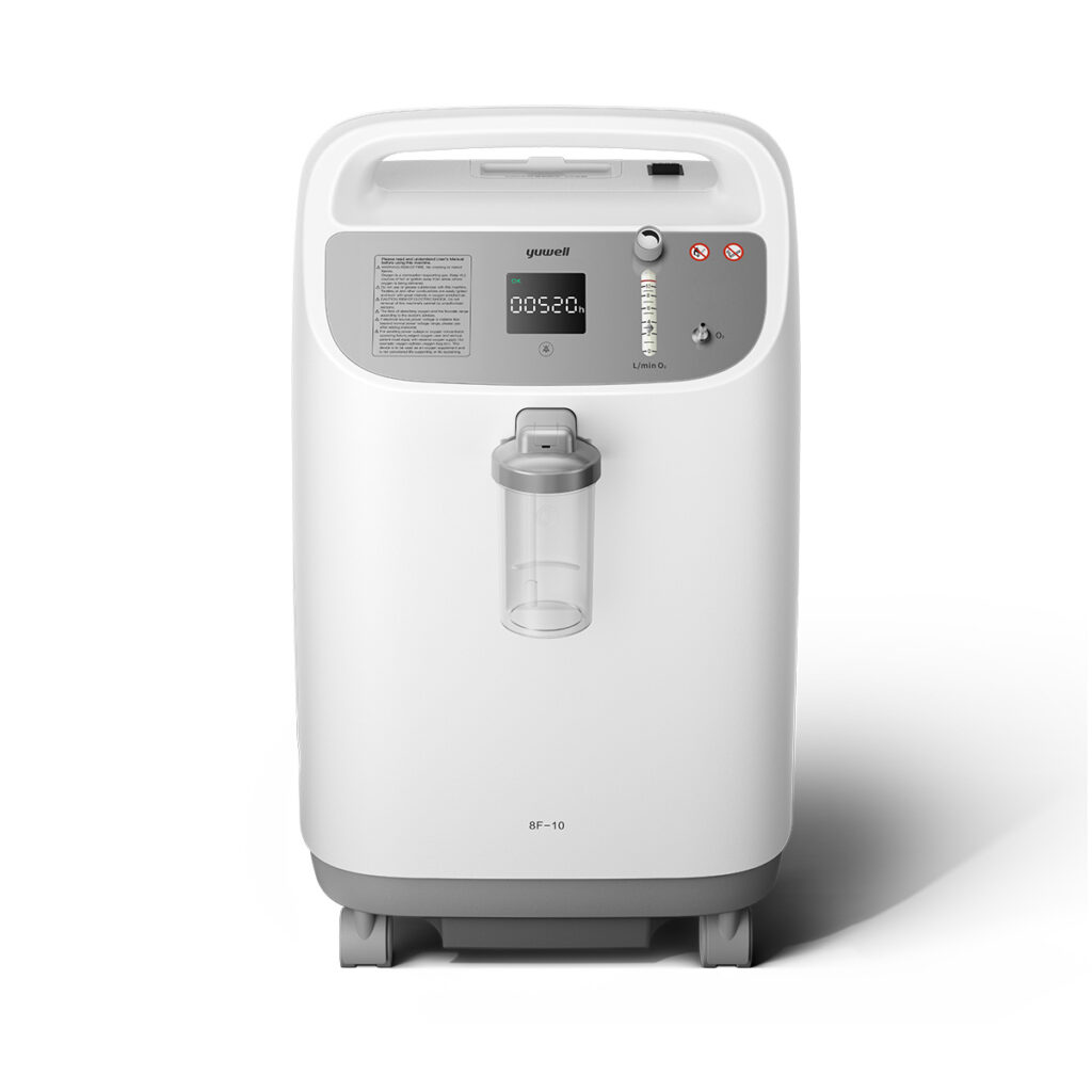 White home oxygen concentrator with a digital display, flow meter, and a hanging humidifier bottle in the front.