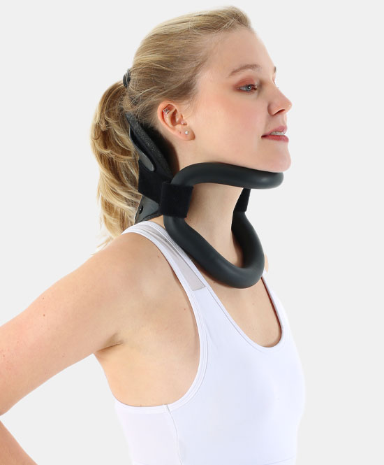 Woman wearing a black cervical traction neck brace around her neck, shown in side profile.