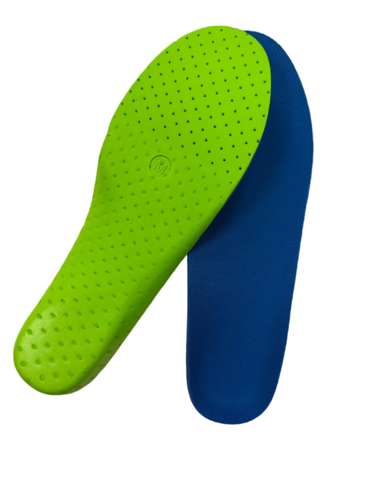 Close-up of lime green perforated insole overlapping a blue athletic insole, showing textured surface and small holes for breathability.